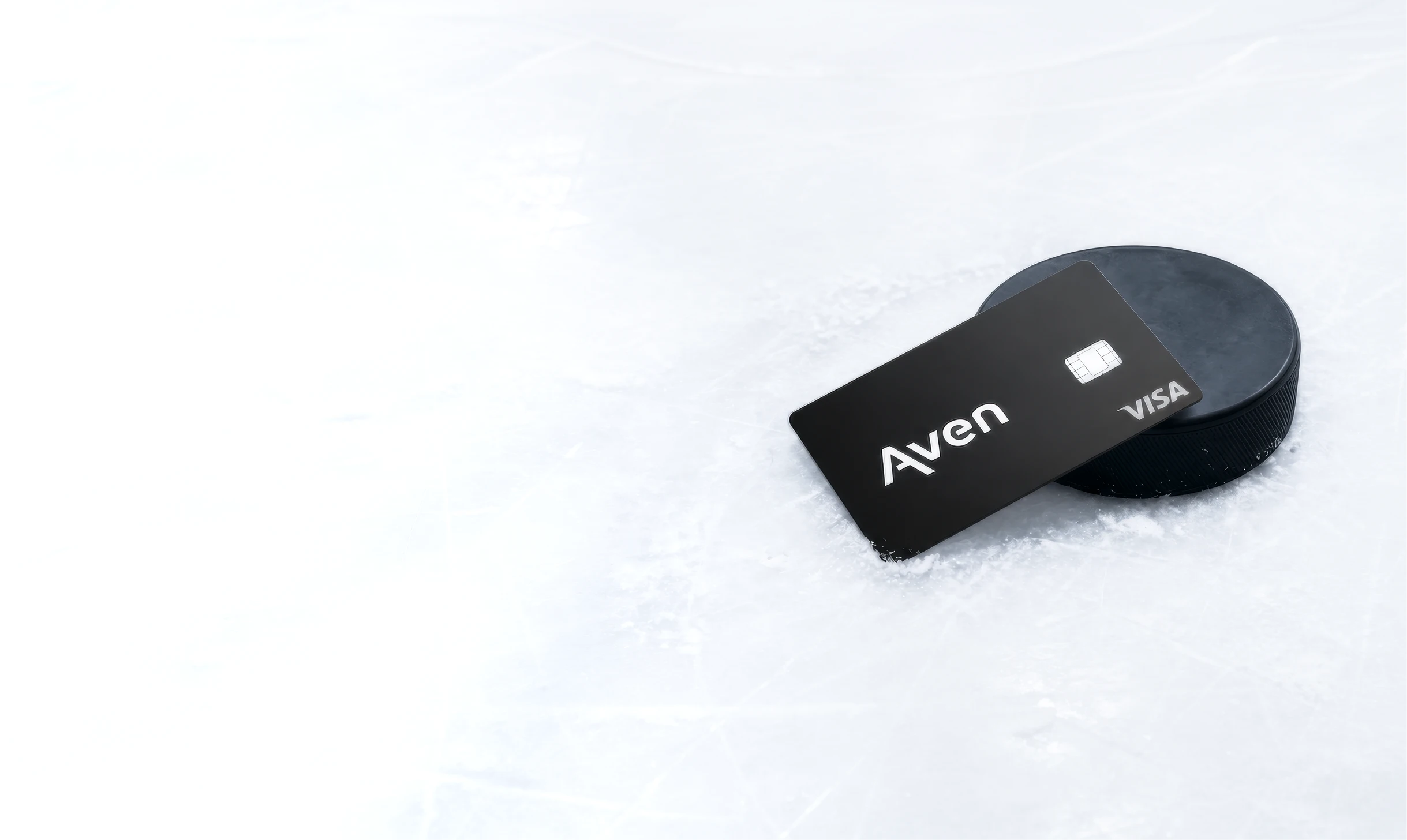 Aven card on a hockey puck and ice rink